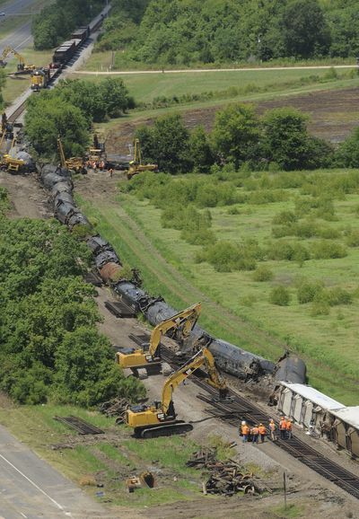 Railroad repair crews work to repair 1,800 feet of Union Pacific railroad track after an eastbound train derailed near Lawtell, La.