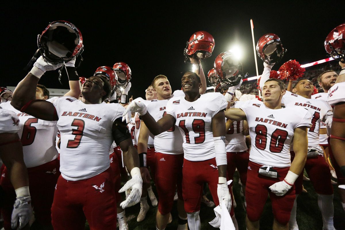 Eastern Washington’s Samson Ebukam (3), Josh Lewis (19), Zach Eagle (80) and teammates celebrate after defeating Washington State 45-42 in Pullman on Sept. 3, 2016, the last time the Eagles upset a Football Bowl Subdivision opponent.  (Associated Press)