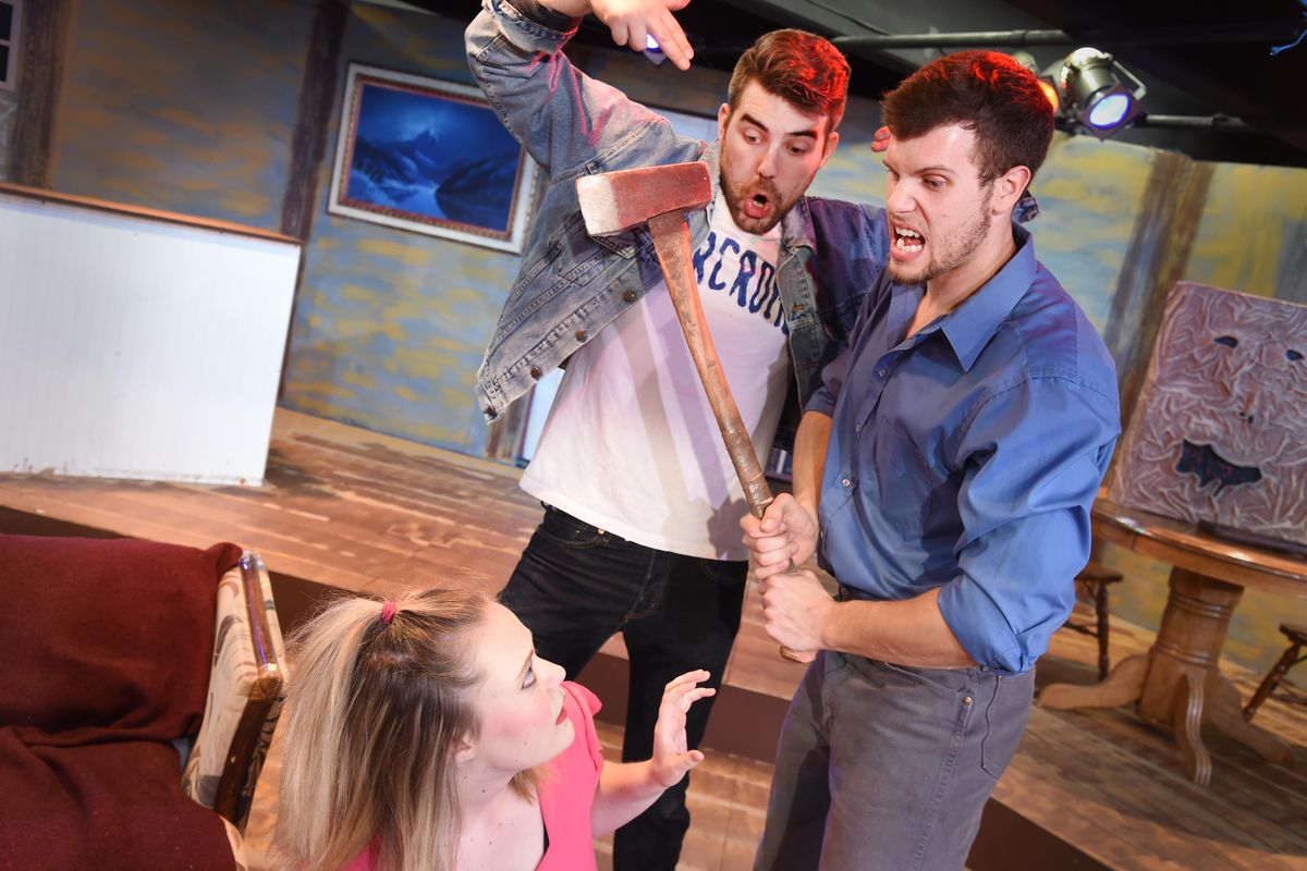 The cast of “Evil Dead the Musical,” from left, Talena Kelln, Alexander Edmonds, and Martin Sanks play out a scene in a remote cabin in the play based on the campy horror movie series. Martin Sanks plays Ash, the dubious hero. JESSE TINSLEY jesset@spokesman.com (Jesse Tinsley / The Spokesman-Review)