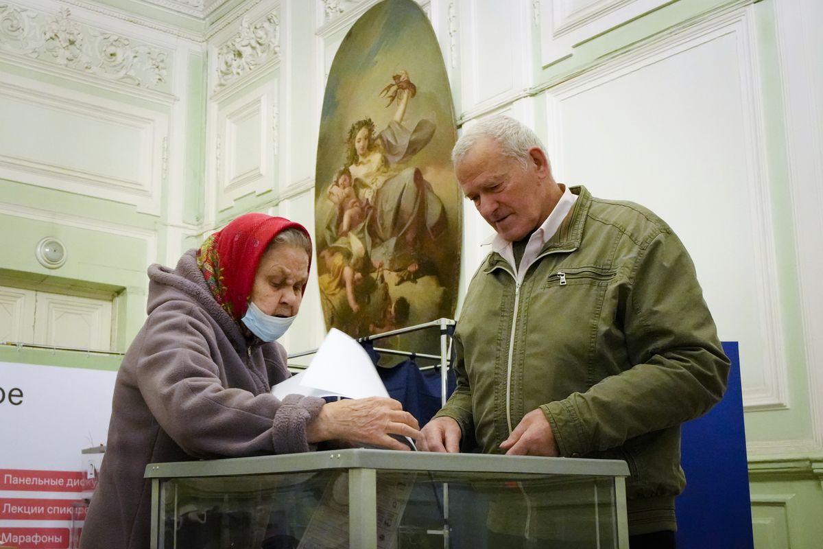 People cast their ballots during the State Duma, the Lower House of the Russian Parliament and local parliaments elections at a polling station situated in an old palace in St. Petersburg, Russia, Saturday, Sept. 18, 2021. Sunday will be the last of three days voting for a new parliament, but there seems to be no expectation that United Russia, the party devoted to President Vladimir Putin, will lose its dominance in the State Duma.  (Dmitri Lovetsky)