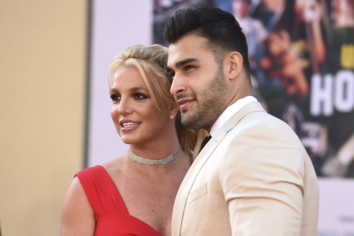Britney Spears and Sam Asghari arrive at the Los Angeles premiere of "Once Upon a Time in Hollywood" at the TCL Chinese Theatre on Monday, July 22, 2019. Spears announced on Instagram on Sunday, Sept. 12, 2021, that she and Asghari are engaged. The couple met on the set of her “Slumber Party” music video in 2016.  (Jordan Strauss/Invision/AP)