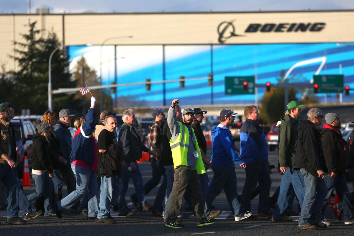 Boeing Machinists march to cast their vote at the International Association of Machinists union hall Nov. 13, 2013, in Everett, Wash. The union, which organized the Boeing workforce in Everett in 1935, was hardly the sole barrier to racial integration at Boeing. (Joshua Trujillo / seattlepi.com)