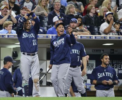 Seattle Mariners Robinson Cano, Leonys Martin, Seth Smith and Nelson Cruz, from left, celebrate during the seventh inning against the San Diego Padres. (Lenny Ignelzi / Associated Press)