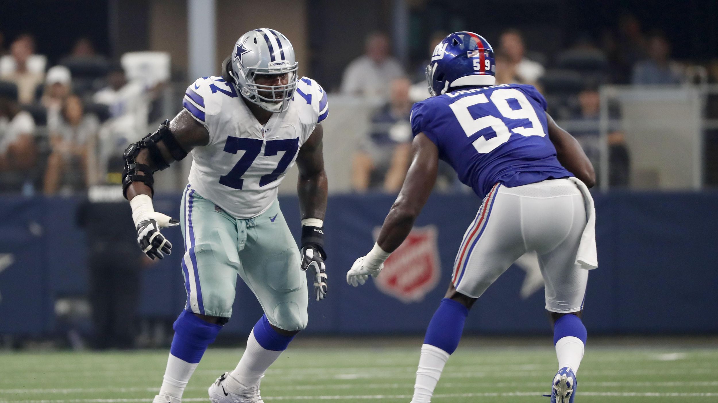 Dallas Cowboys tackle Tyron Smith (77) in action.in an NFL