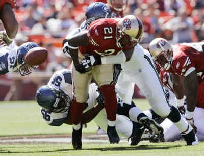 
Seattle would like to see more defensive plays like this one in which Darryl Tapp's tackle of 49ers' Frank Gore forced a fumble. Associated Press
 (Associated Press / The Spokesman-Review)