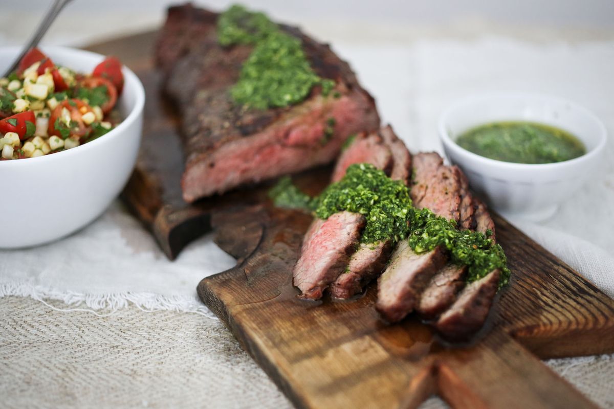 Grilled beef tri tip with arugula chimichurri proves a delicious use for the leafy green.