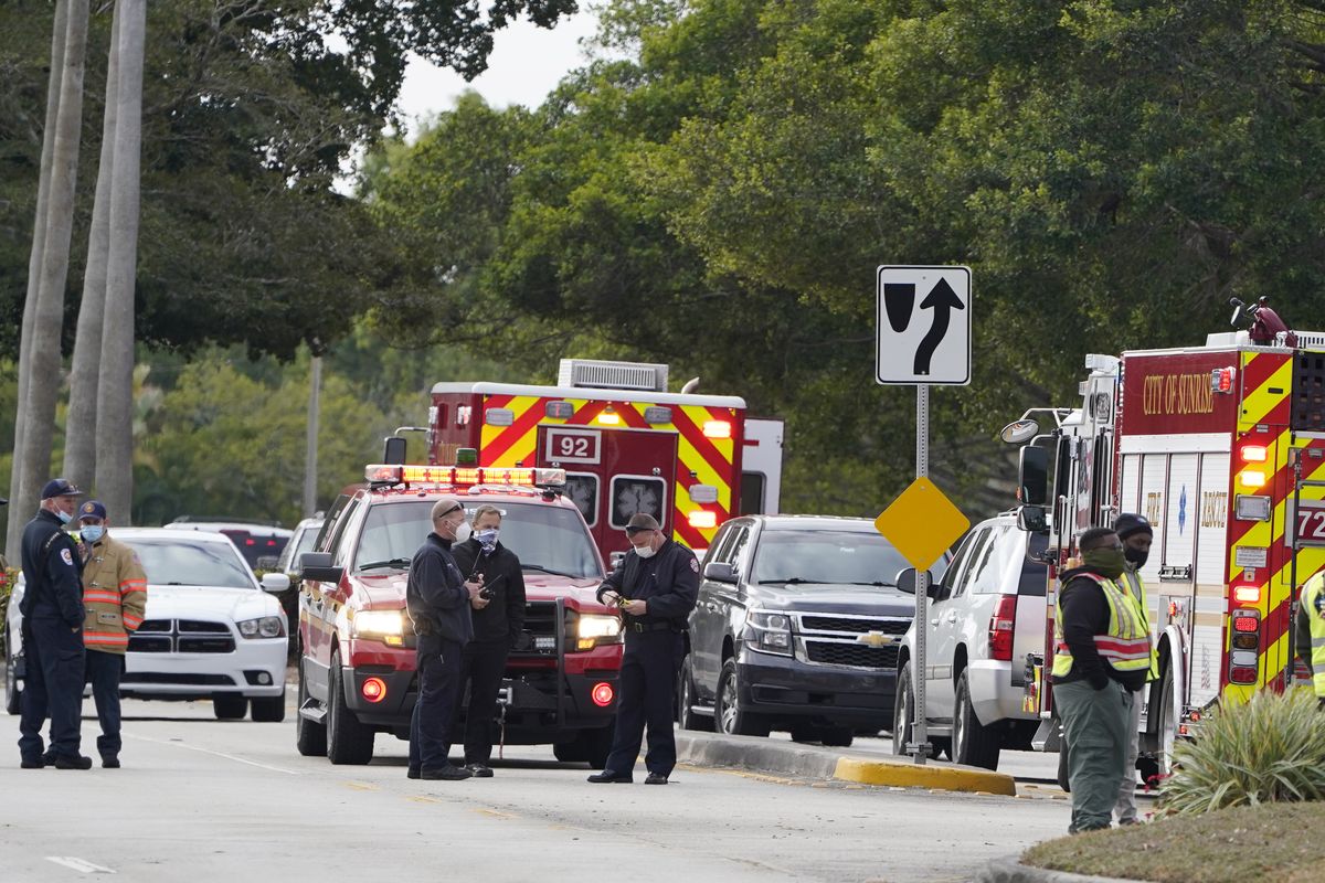 Law enforcement officers block an area where a shooting wounded several FBI while serving an arrest warrant, Tuesday, Feb. 2, 2021, in Sunrise, Fla.  (Marta Lavandier)