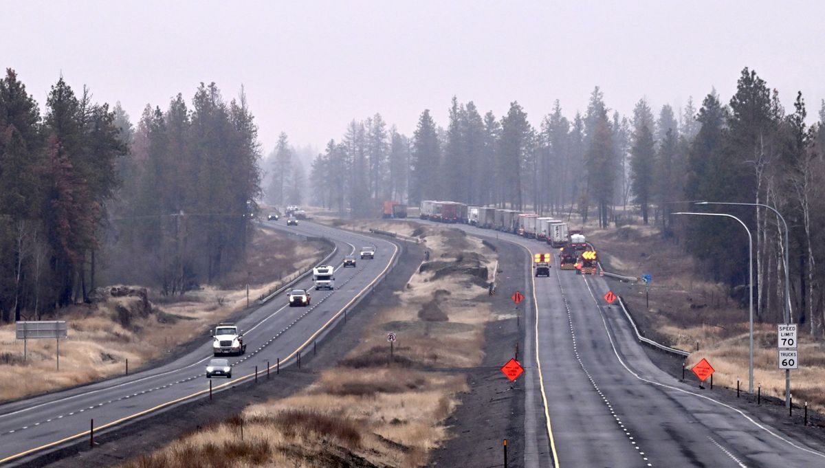 Westbound traffic, left, flows on Interstate 90 while eastbound traffic waits as law enforcement works to move the wreckage of an early morning tanker fire Thursday east of the Salnave Road exit.  (Jesse Tinsley/THE SPOKESMAN-REVIEW)