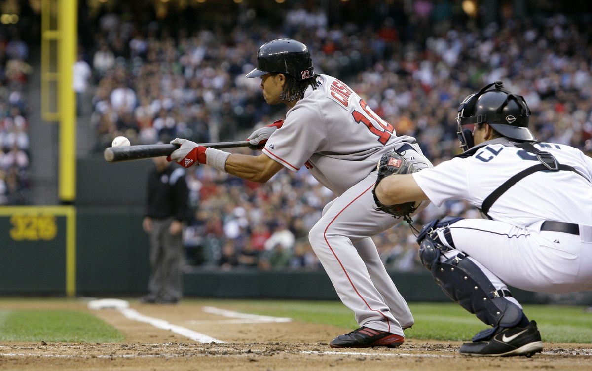 Boston’s Coco Crisp lays down a sacrifice bunt.  (Associated Press / The Spokesman-Review)