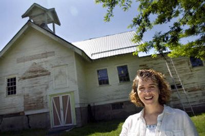 
Margaret Evans stands in front of the Valley Prairie Grange Hall, which she and her husband, Carl, bought in 2000 and have been restoring. 
 (Photos by Holly Pickett / The Spokesman-Review)