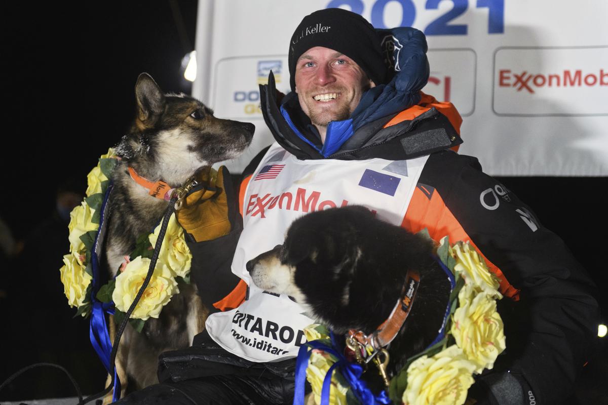 Dallas Seavey poses with his dogs after winning the Iditarod Trail Sled Dog Race race near Willow, Alaska, early Monday, March 15, 2021. (Marc Lester)