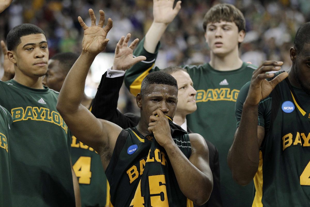 Baylor players, including Tweety Carter (45), found Sunday’s loss emotionally draining.  (Associated Press)