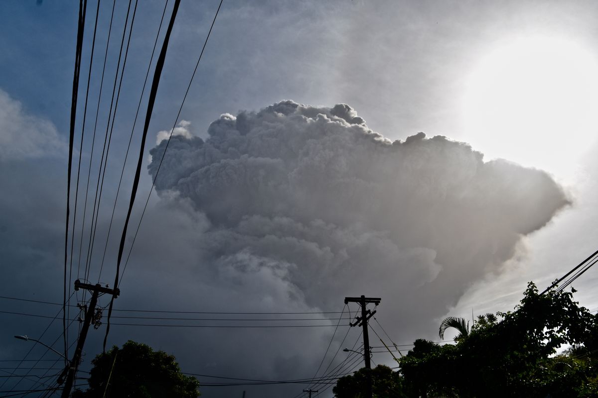 Ash rises into the air as La Soufriere volcano erupts on the eastern Caribbean island of St. Vincent, seen from Chateaubelair, Friday, April 9, 2021.  (Orvil Samuel)