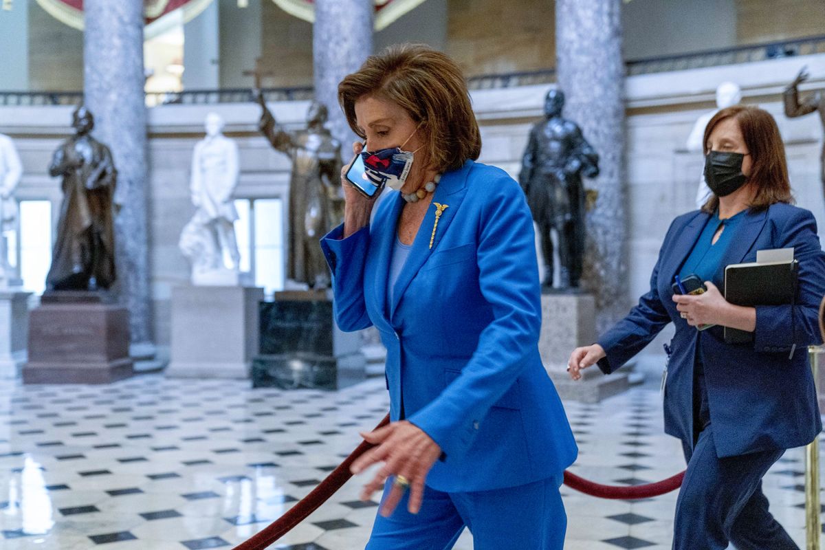 House Speaker Nancy Pelosi of Calif., walks towards the House Chamber to convene the House for legislative business at the Capitol in Washington, Tuesday, Oct. 12, 2021. The House is expected to vote to increase the debt limit later this afternoon.  (Andrew Harnik)