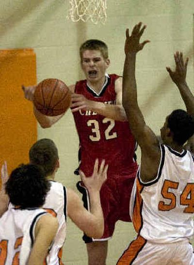 
WV's E.J. Richardson, right, defends as Cheney's Matt Brunell loses a rebound. 
 (Colin Mulvany / The Spokesman-Review)