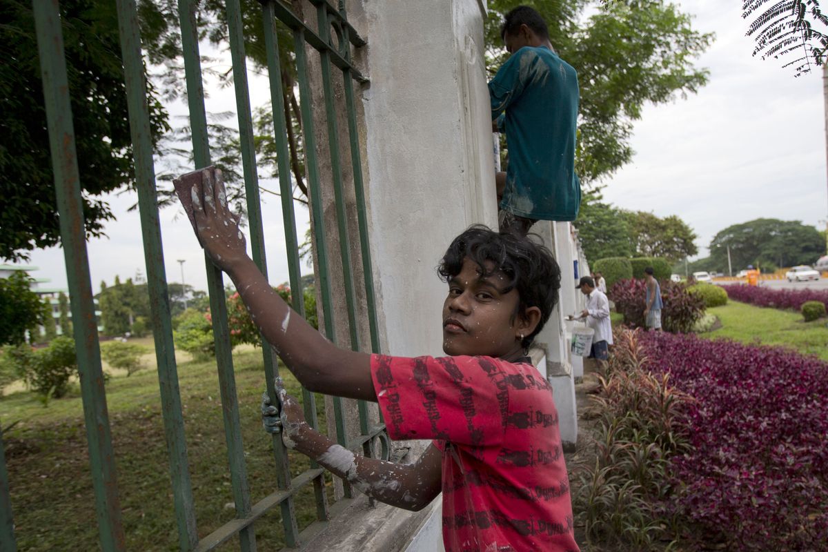 Workers paint the fencing of the Yangon Parliament building where US president Barack Obama is anticipated to meet Myanmar's President Thein Sein in Yangon, Myanmar, Thursday, Nov. 15, 2012. Obama, who visits Myanmar on November 19,  will meet democracy icon Aung San Suu Kyi and President Thein Sein on the first visit to the country by a sitting US president. (Gemunu Amarasinghe / Associated Press)