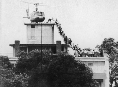 Hubert Van Es took this photo of an Air America helicopter crew member helping evacuees up a ladder April 29, 1975,  before  Saigon fell to  North Vietnamese troops.United Press International (United Press International / The Spokesman-Review)