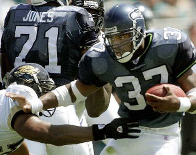 
Seattle Seahawks running back Shaun Alexander was slowed down during Sunday's second half against Jacksonville. 
 (Associated Press / The Spokesman-Review)