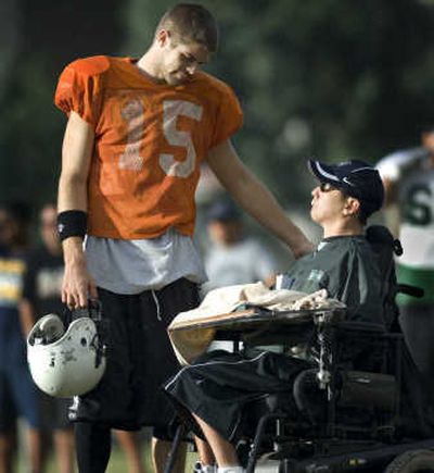 
Hawaii quarterback Colt Brennan talks with Brian Kajiyama on the sidelines during a Warriors football practice in preparation for the Sugar Bowl. Associated Press
 (Associated Press / The Spokesman-Review)