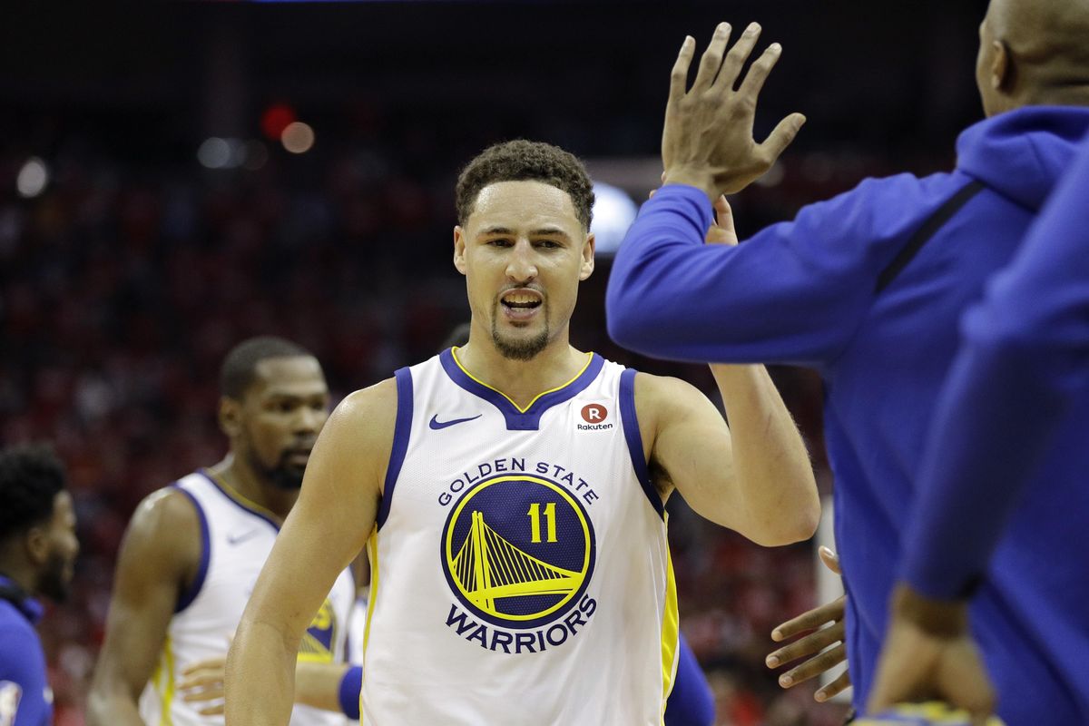 Golden State Warriors guard Klay Thompson (11) celebrates with teammates during the second half of Game 1 of the NBA basketball Western Conference Finals against the Houston Rockets, Monday, May 14, 2018, in Houston. (David J.Phillip / Associated Press)