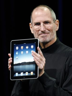  Apple CEO Steve Jobs shows off the iPad in January.  (Associated Press)