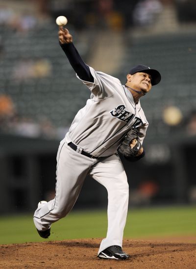 Mariners’ Felix Hernandez delivers a pitch against the  Orioles during the first inning of Wednesday’s game.  (Associated Press / The Spokesman-Review)