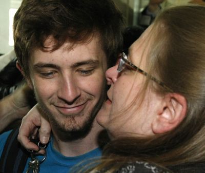 Silas Thompson of Twin Falls, Idaho, is hugged by his mother Renee after arriving at the Kansas City International Airport  Thursday, Feb. 18, 2010 in Kansas City. Mo. Thompson was   among a group of Americans arrested in Haiti on child abduction charges after the Jan. 12, earthquake. (Charles Arbogast / Associated Press)
