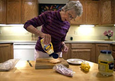 Melba Tschirley puts some mayonnaise onto a piece of Tapioca Rice Bread, which contains white rice flour, water, tapioca starch, whole eggs, whey powder, yeast, sunflower oil, sugar, sodium carboxy Methylcellulose and salt. Tschirley, who was diagnosed with celiac disease in 1996, cannot eat food with gluten, a protein found in wheat.
(Liz Kishimoto / The Spokesman-Review)