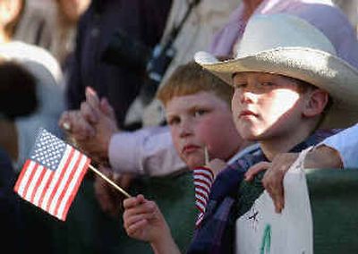 
Jacob Pitkofsky, of Ruidoso, N.M., holds a flag during President Bush's campaign rally Sunday in Alamogordo, N.M. 
 (Associated Press / The Spokesman-Review)