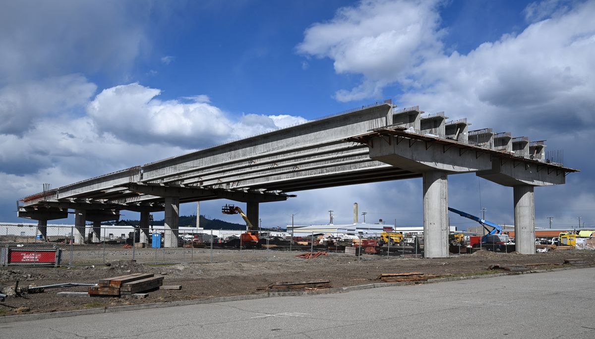 The first prestressed concrete beams are placed on new supports of the North-South Corridor project between East Olive and East Alki Avenues just west of the Freya Street in East Spokane, shown Thursday, April 24, 2026. There is rapid construction going on on the elevated section of the North-South reeway between Mission Avenue and Sprague Avenue through Spokane industrial and warehouse area. The plans call for a full connection from Mission Avenue to I-90 by 2029.  (Jesse Tinsley/THE SPOKESMAN-REVIEW)
