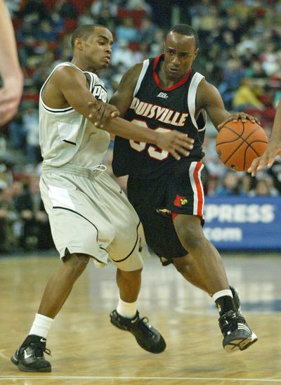 Andre McGee played at Louisville and was director of basketball operations 2012-14. (Associated Press)