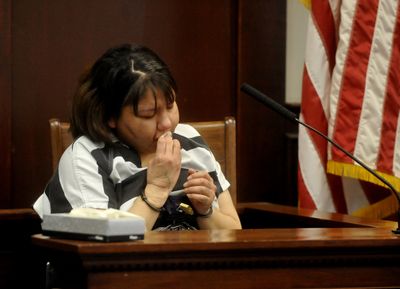Summer ManyWhiteHorses wipes away tears as she sits on the witness stand to plead guilty to negligent homicide and tampering with evidence in the death of her 2-year-old son in May  2008, at the  county courthouse in Great Falls on Friday.  (Associated Press / The Spokesman-Review)