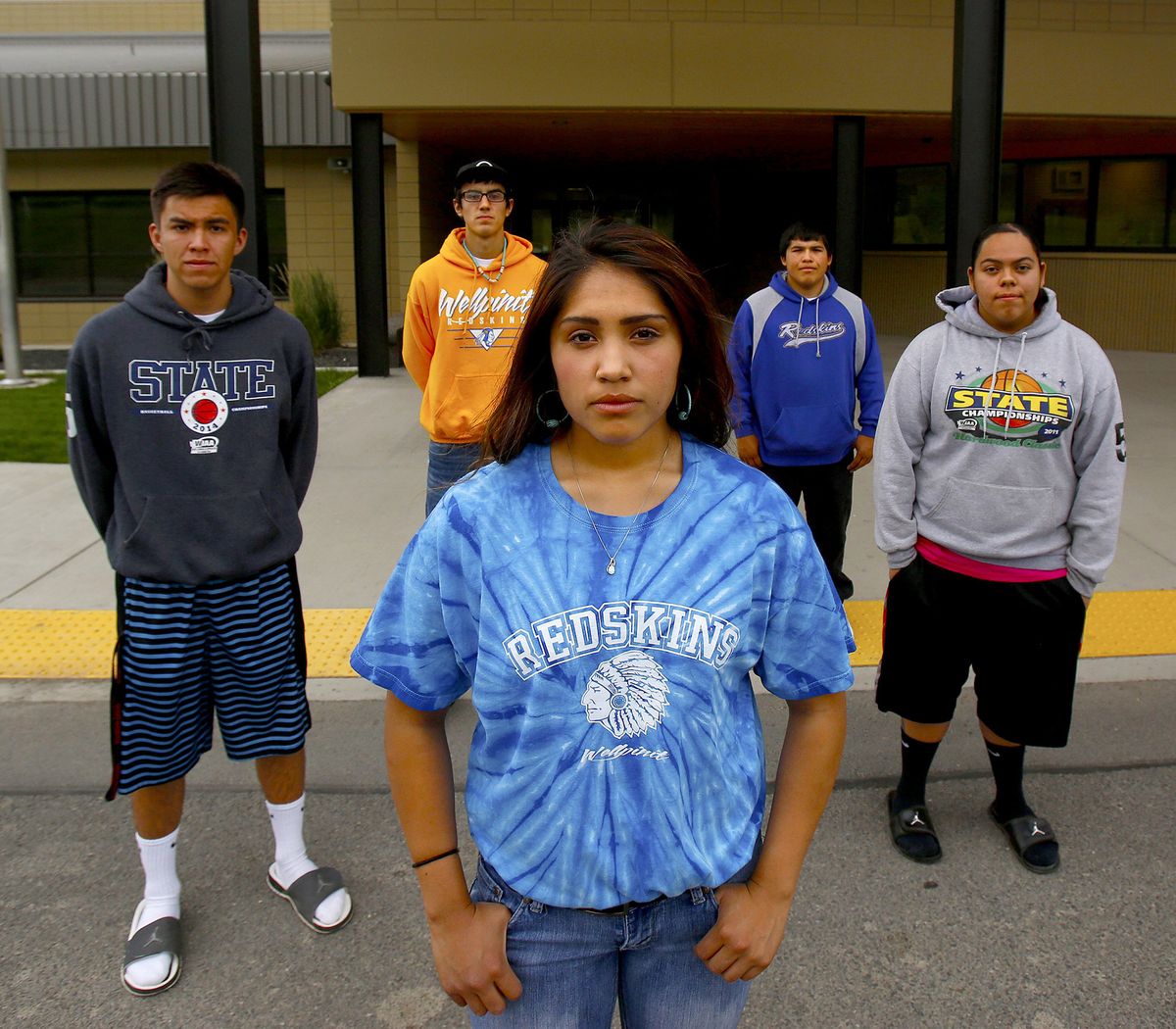 From left, James Best, 18; Brodie Ford, 17; Kyra Antone, 17; Triston Andrews, 17; and Sami Parr, 19, attend Wellpinit High School. The school serves the Spokane Indian Reservation, and its mascot is the Redskins. (Mark Harrison / The Seattle Times)