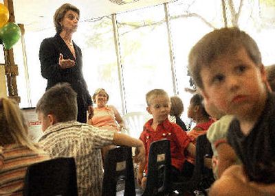 
Gov. Christine Gregoire speaks to children at the Little Red Schoolhouse in Spokane on Thursday. 
 (Jed Conklin / The Spokesman-Review)