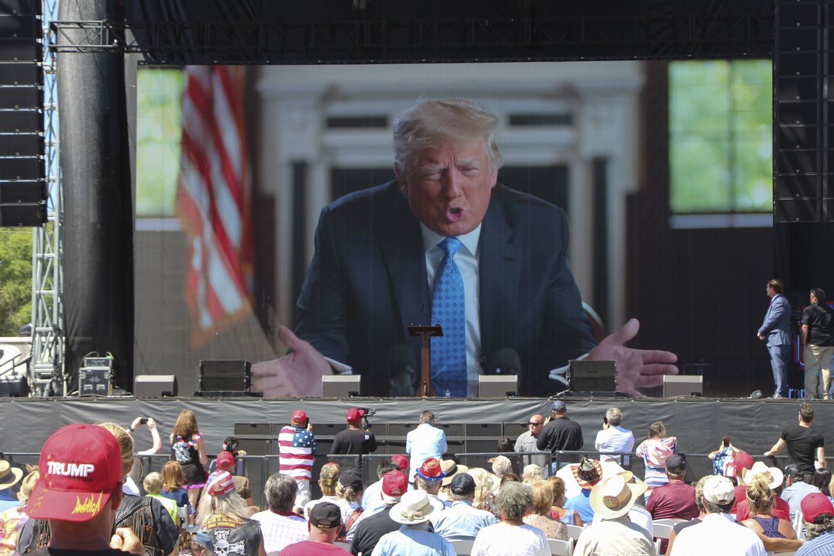 Former President Donald Trump addresses the crowd via video Saturday, June 12, 2021, at the River