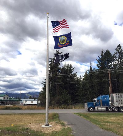 Since the establishment of the Bonners Ferry Port of Entry more than two decades ago, there has always been something missing: the U.S. flag, the Idaho state flag and the POW/MIA flag. Not anymore, as the colors now fly above. (Mike  Prager / The Spokesman-Review)