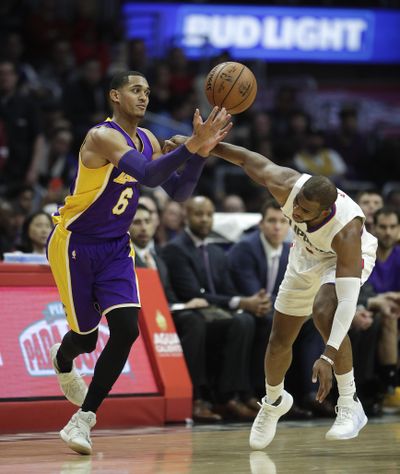 Los Angeles Lakers' Jordan Clarkson, left, grabs the ball against Los Angeles Clippers' Chris Paul during the second half of an NBA basketball game Saturday, Jan. 14, 2017, in Los Angeles. (Jae C. Hong / Associated Press)