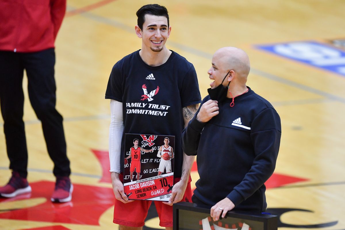 Eastern Washington guard Jacob Davison watches with Eagles head coach Shantay Legans as he’s introduced during Senior Night on March 5 against Idaho State at Reese Court in Cheney.  (Tyler Tjomsland/The Spokesman-Review)