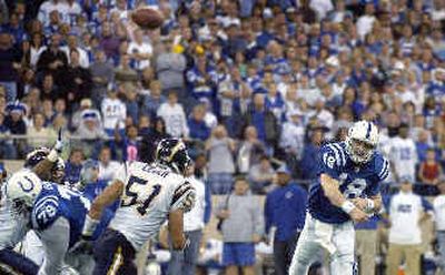 
Colts QB Peyton Manning throws his record-setting 49th touchdown pass.
 (Associated Press / The Spokesman-Review)