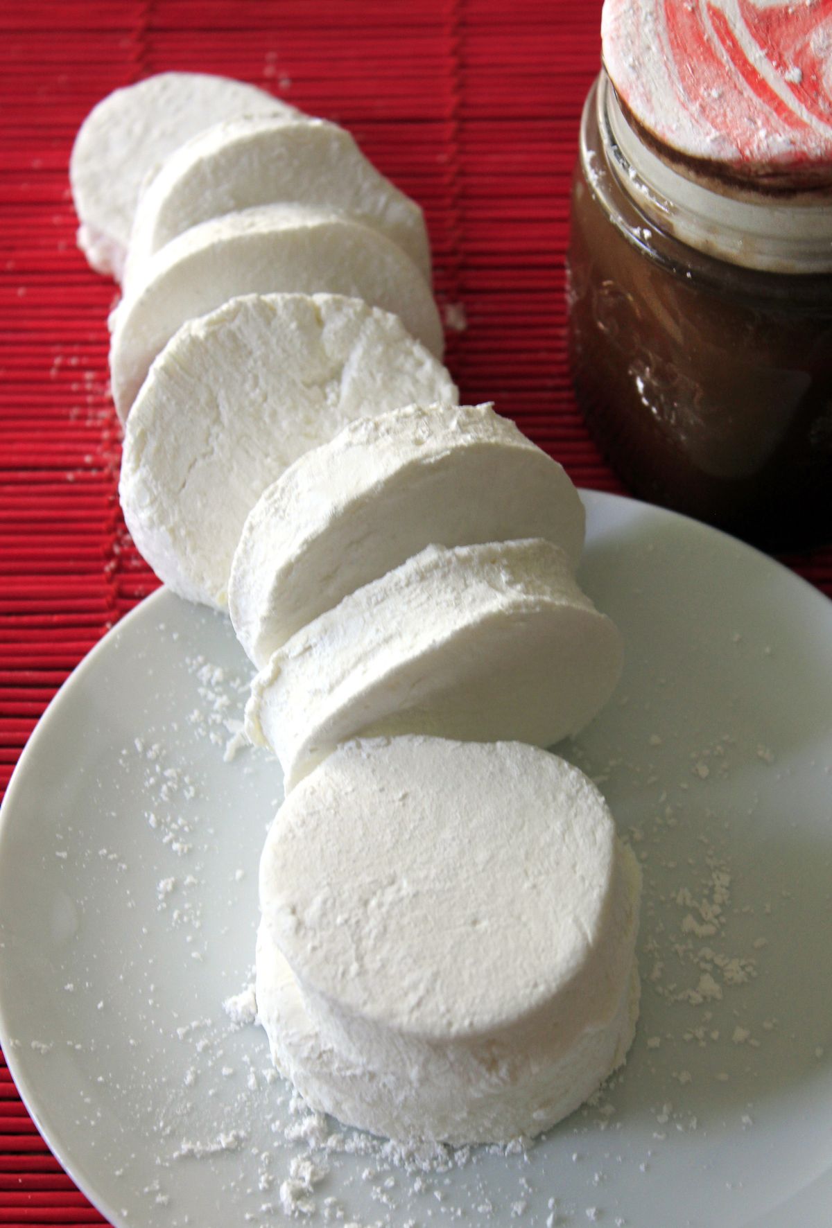 Biscuit cutters are used to shape homemade marshmallows into rounds, like these vanilla bean marshmallows, front, and peppermint marshmallows, back right, topping some hot cocoa. (Adriana Janovich)