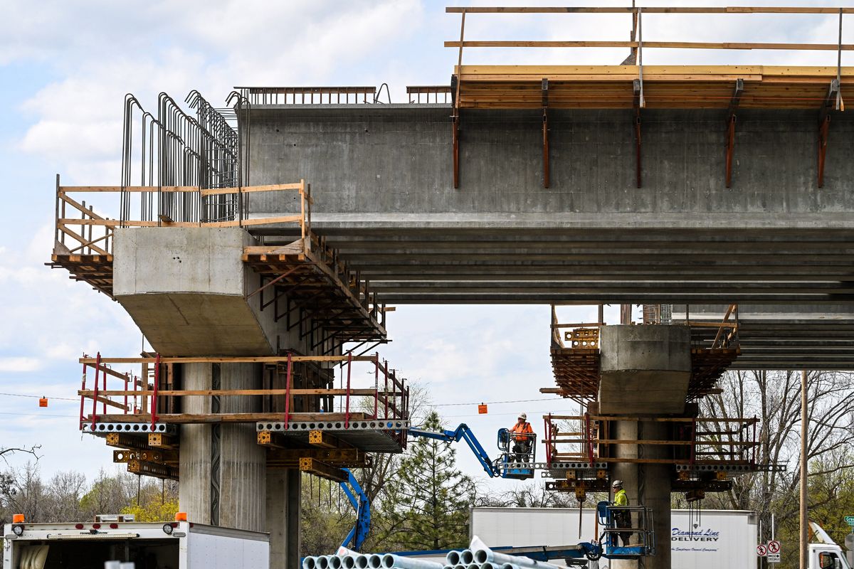 Crews work near Greene Street at Carlisle Avenue on the continuing construction of the state Department of Transportation’s North Spokane Corridor on Friday. With funds secured, the freeway is slated to be completed in 2030.  (DAN PELLE/THE SPOKESMAN-REVIEW)