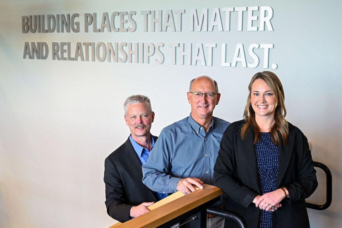 At the Bouten Construction office, left to right, Tim Thomas, president; Bill Bouten, CEO, and Karlee Agee, VP of operations. They are part of Bouten Construction, a company that has been in Spokane for 80 years.  (Colin Mulvany / The Spokesman-Review)