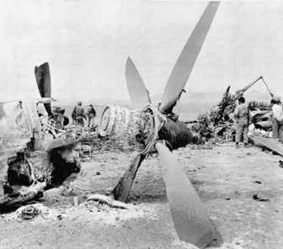 
A propeller from a burned-out American C-130 cargo plane used in the aborted raid to rescue U.S. embassy hostages lies amid the plane's wreckage in the eastern desert region of Iran on April 26, 1980. 
 (File/Associated Press / The Spokesman-Review)
