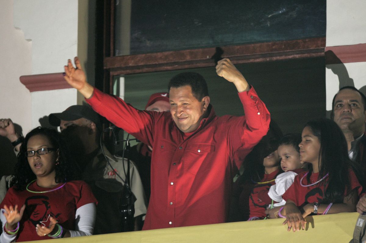 Chavez waves to supporters from the balcony of Miraflores presidential palace. (Fernando Llano / The Spokesman-Review)