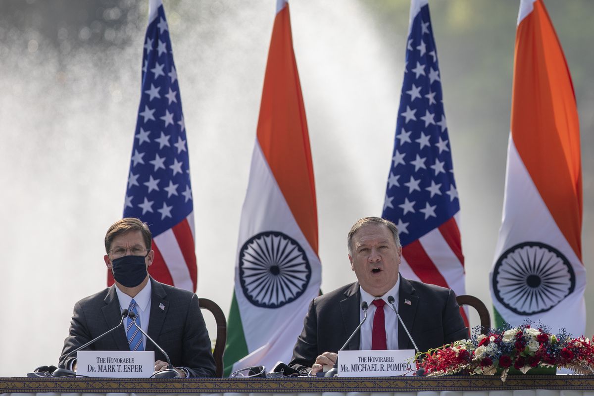 U.S. Secretary of State Mike Pompeo, right, speaks with Secretary of Defence Mark Esper seated beside him during a joint press conference with their Indian counterparts at Hyderabad House in New Delhi, India, Tuesday, Oct. 27, 2020. With President Donald Trump in a tight race for a second term against former Vice President Joe Biden, Pompeo and Esper sought to play on Indian suspicions about China to shore up a regional front against increasing Chinese assertiveness in the Indo-Pacific region.  (Altaf Qadri)