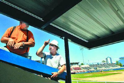 
Garco Construction employees Gary Nutt, left, and Ray Boyd work on a new concession stand at Avista Stadium. 
 (Jed Conklin / The Spokesman-Review)