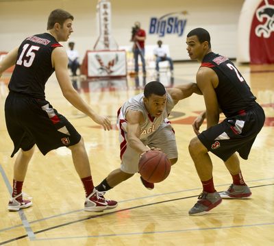 EWU's Glen Dean makes a break for the basket between Seattle University's Chad Rasmussen (15) and Aaron Broussard (2). (Colin Mulvany / The Spokesman-Review)