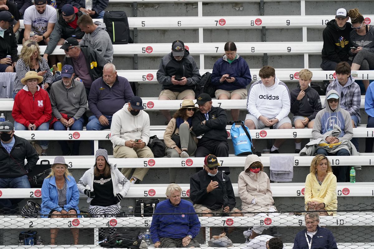 Fans watch during the final practice session for the Indianapolis 500 auto race at Indianapolis Motor Speedway, Friday, May 28, 2021, in Indianapolis.  (Darron Cummings)