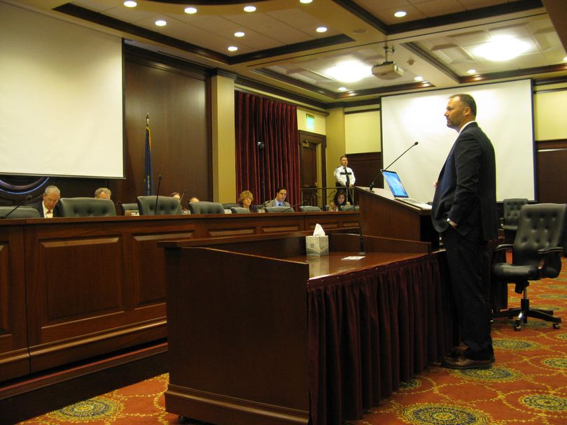 Doug Okunewicz, general manager of Coeur d'Alene Racing, answers questions from the House State Affairs Committee on Wednesday about 