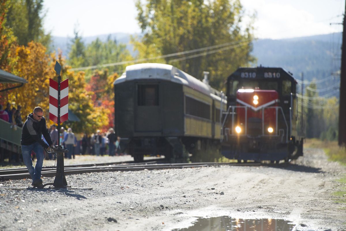 Conductor Brett Shults switches tracks as the engine for The North Pend Oreille Valley Lions Excursion Train Ride prepares to hook up on Sunday, Oct 2, 2016, in Ione Wash. (Tyler Tjomsland / The Spokesman-Review)